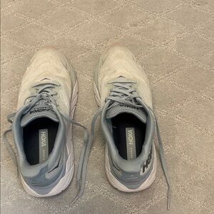 HOKA light blue athletic shoes